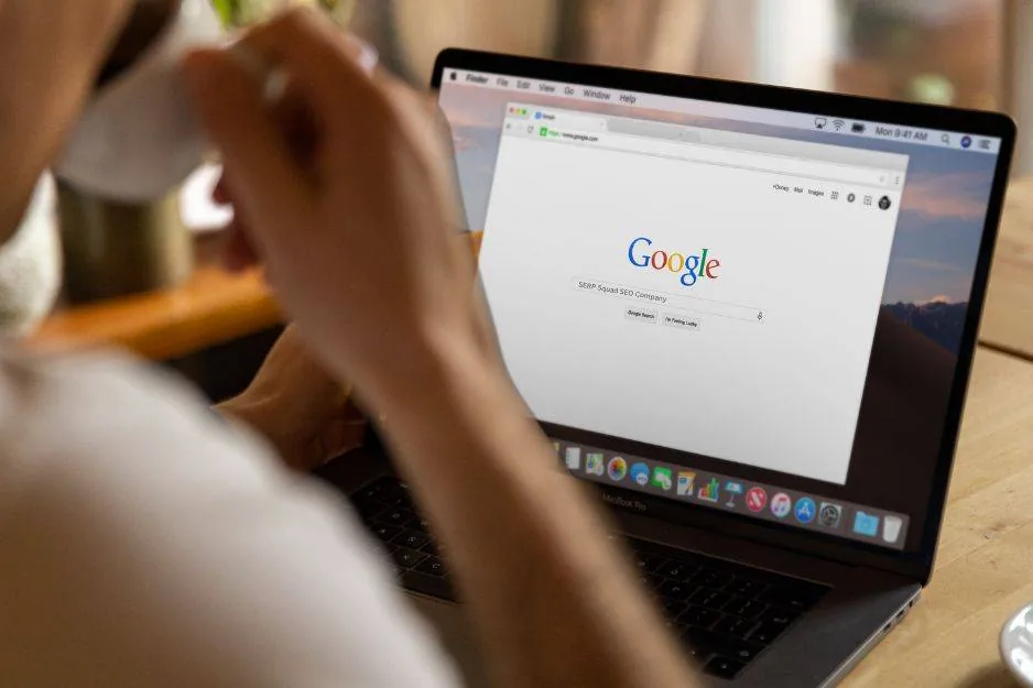Someone searching Google for SERP Squad, the SEO and digital marketing agency, on a laptop